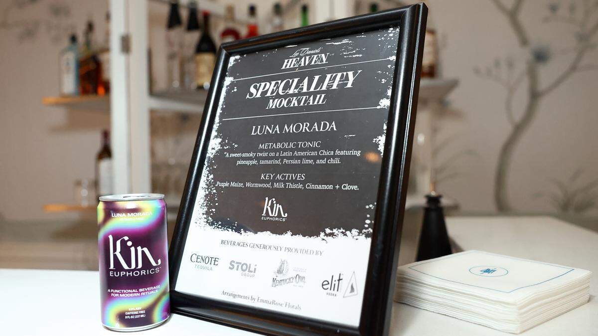Mocktail signage with a Kin Euphorics can next to it.