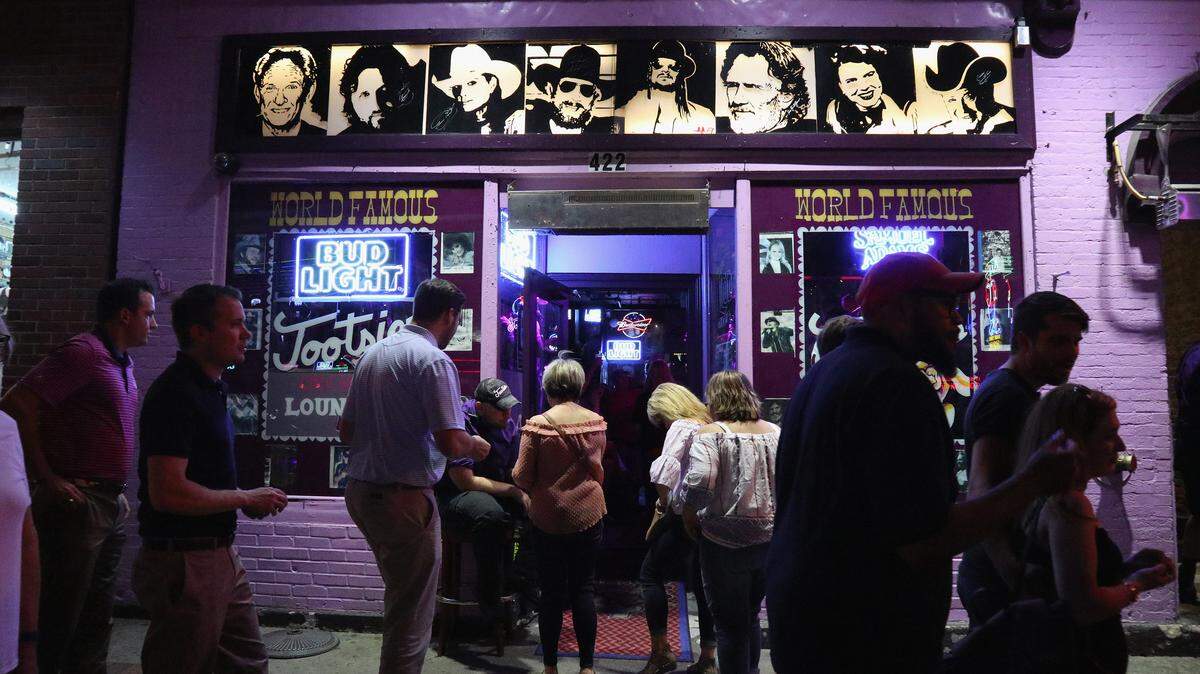 An exterior view of patrons entering Toosies Lounge in Nashville, Tennessee.